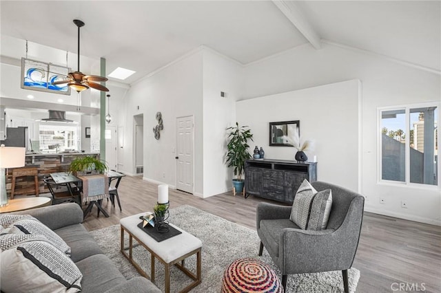 living room featuring a skylight, high vaulted ceiling, beam ceiling, and wood-type flooring