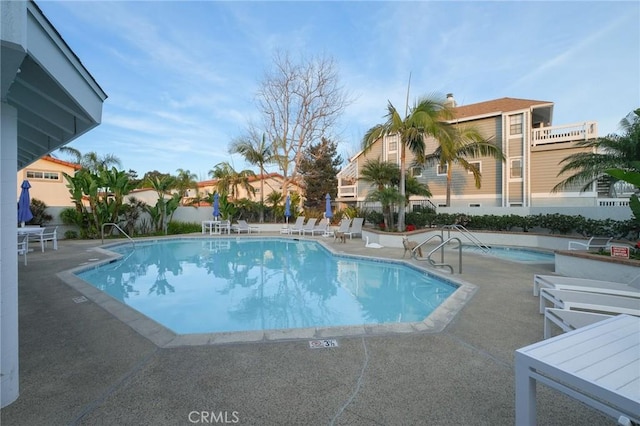 view of pool featuring a patio