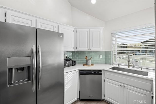 kitchen featuring sink, white cabinets, and stainless steel appliances