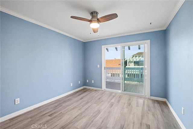 spare room featuring light wood-type flooring, ceiling fan, and ornamental molding