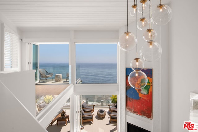 details featuring wooden ceiling and a water view