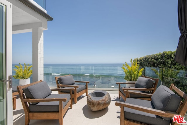 balcony featuring a water view