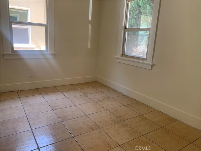 empty room with light tile patterned floors