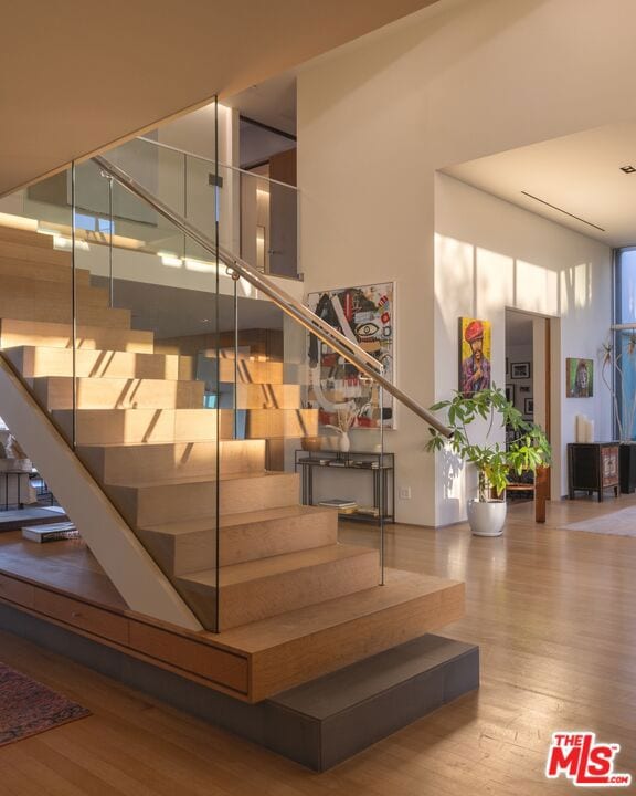 stairway featuring hardwood / wood-style floors