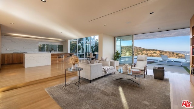 sunroom / solarium featuring a mountain view