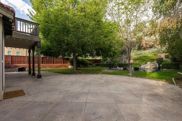 view of patio featuring a balcony