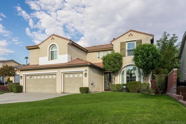 mediterranean / spanish-style home with a garage and a front lawn