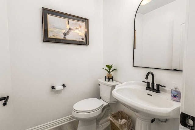 bathroom featuring sink and toilet