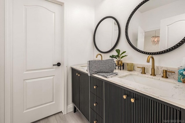 bathroom with vanity and hardwood / wood-style floors