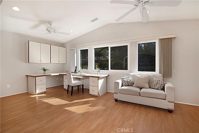 office space with vaulted ceiling, light hardwood / wood-style floors, and ceiling fan