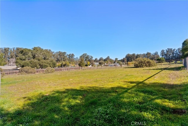 view of yard with a rural view