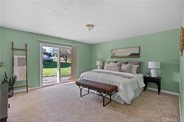 carpeted bedroom with access to exterior