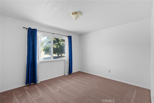 unfurnished room with carpet