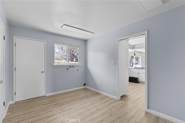 spare room with light wood-type flooring