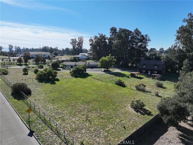 view of yard with a rural view