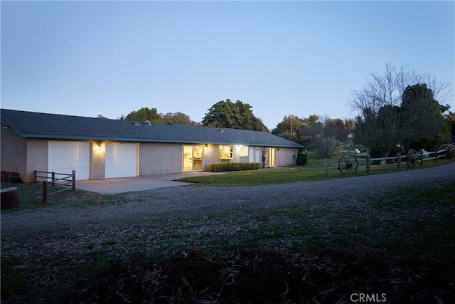 ranch-style house featuring a garage