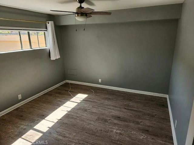 unfurnished room featuring dark hardwood / wood-style flooring and ceiling fan