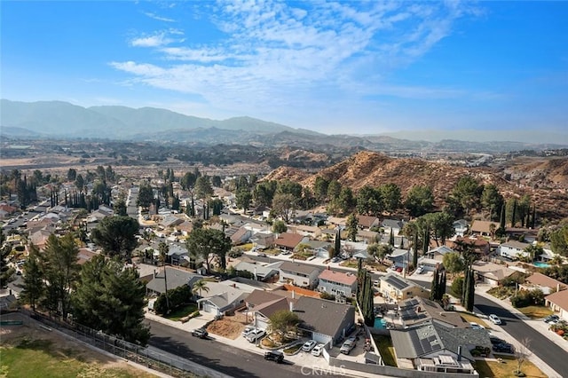 birds eye view of property with a mountain view