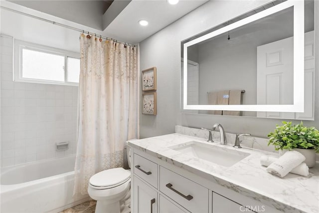 full bathroom featuring vanity, shower / bath combo, and toilet