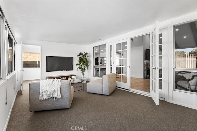 carpeted living room with french doors