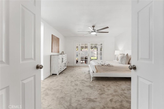 bedroom with light carpet, access to outside, french doors, and ceiling fan