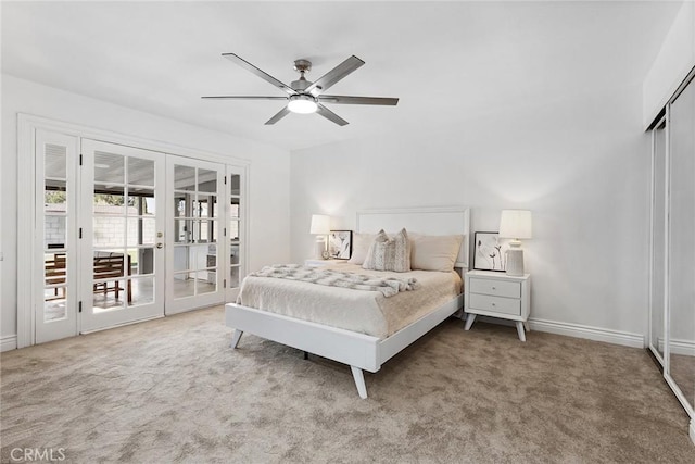 carpeted bedroom with access to outside, french doors, and ceiling fan