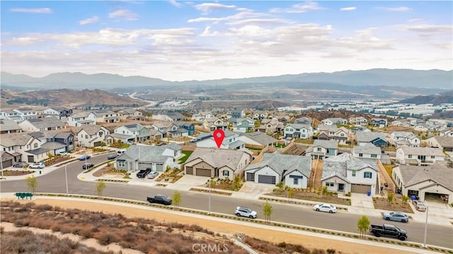 drone / aerial view featuring a mountain view and a residential view