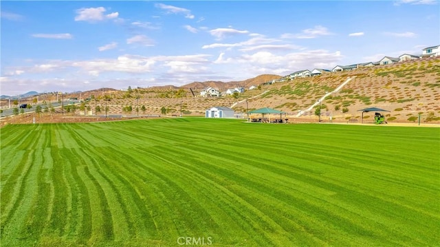 view of yard featuring a gazebo and a mountain view