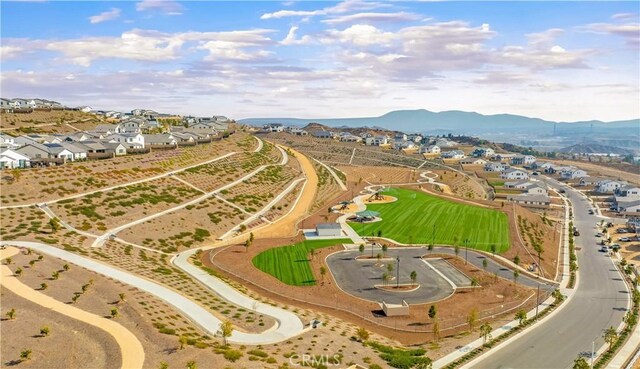 birds eye view of property with a mountain view