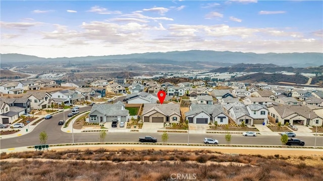 birds eye view of property featuring a residential view and a mountain view