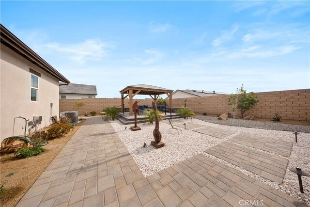 view of patio with a gazebo and cooling unit