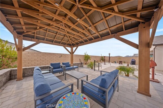 view of patio featuring a gazebo and an outdoor hangout area