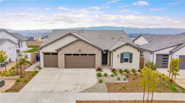 view of front of house with a mountain view and a garage