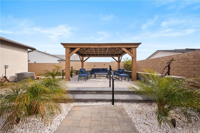 view of patio with a fenced backyard, an outdoor living space, a gazebo, and central air condition unit