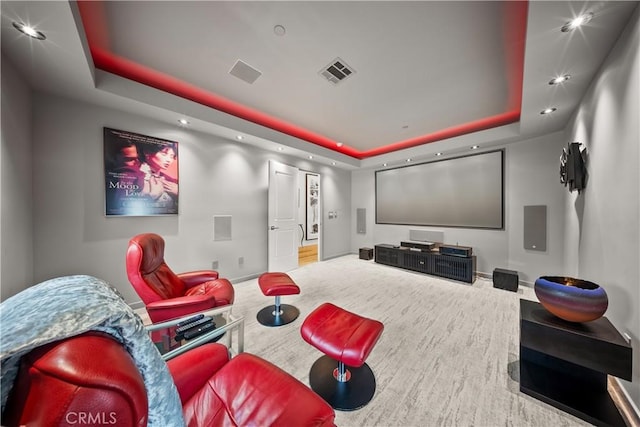 home theater with visible vents, a tray ceiling, baseboards, and recessed lighting