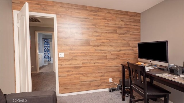 office area featuring wooden walls and carpet