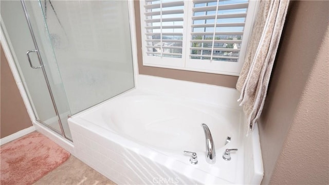 bathroom with plus walk in shower and tile patterned flooring