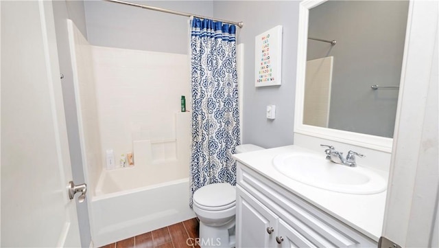 full bathroom with hardwood / wood-style flooring, vanity, toilet, and shower / bath combo with shower curtain