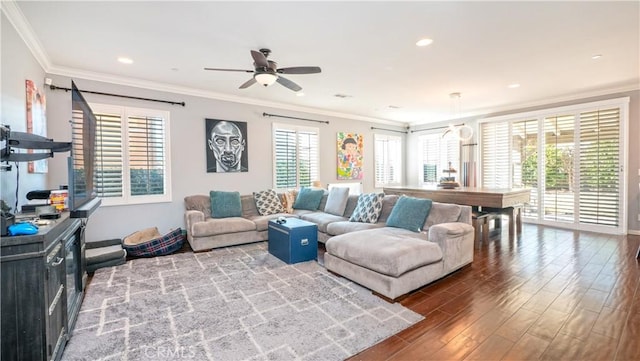 living room featuring crown molding, ceiling fan, and hardwood / wood-style floors