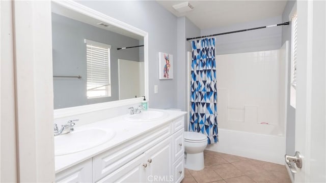 full bathroom with tile patterned flooring, shower / bath combo, vanity, and toilet