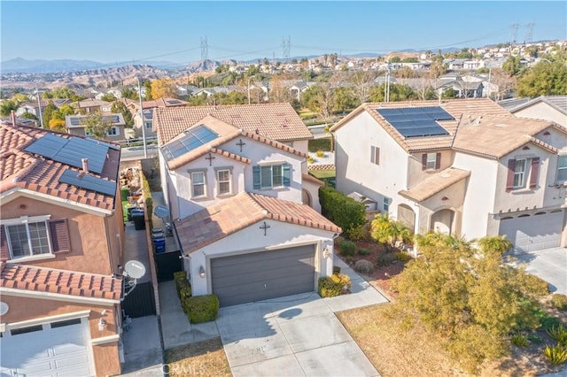 birds eye view of property featuring a mountain view