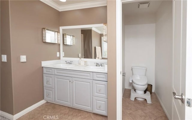 bathroom with vanity, ornamental molding, tile patterned floors, and toilet