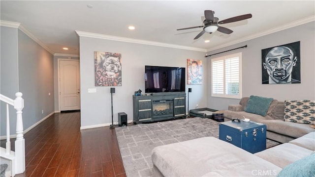 living room with dark wood-type flooring, ceiling fan, and ornamental molding