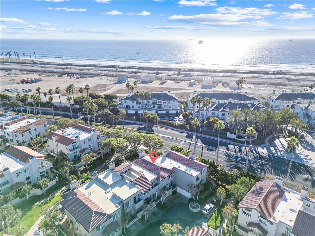 bird's eye view featuring a water view and a view of the beach