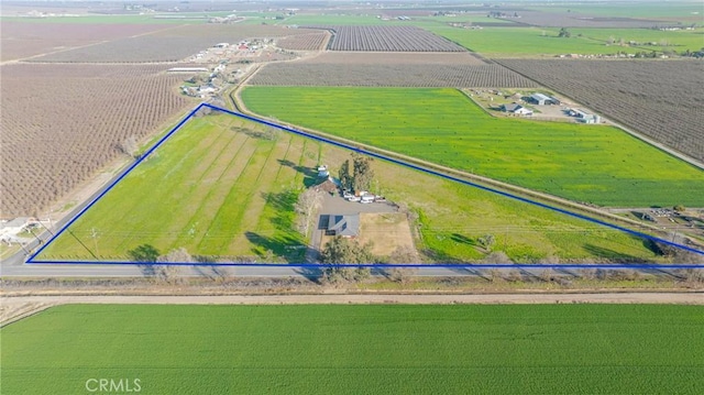 birds eye view of property with a rural view