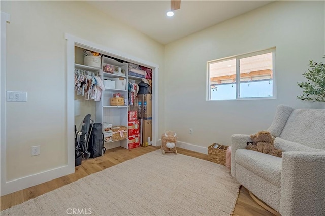 living area with light hardwood / wood-style flooring