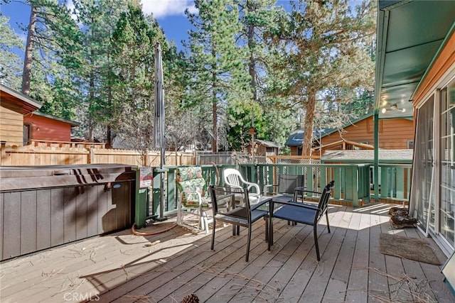 deck featuring a jacuzzi