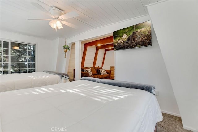 carpeted bedroom with ceiling fan and wood ceiling