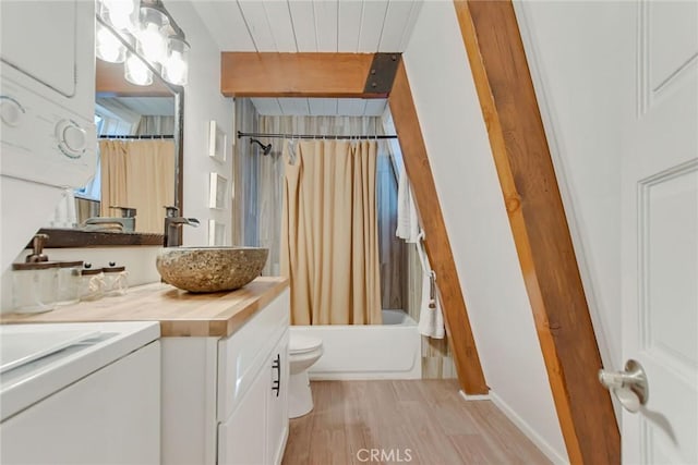 full bathroom with vanity, toilet, hardwood / wood-style floors, and shower / bath combo