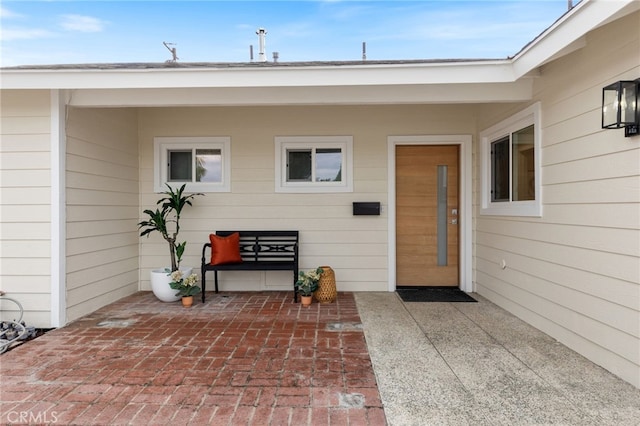 property entrance featuring a patio